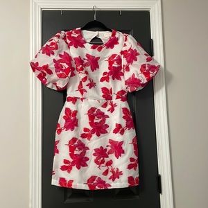 NWT adorable white and floral dress with puff sleeves and an open back!